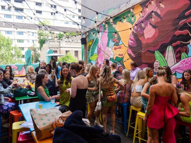 a crowded rooftop bar at Heroes, Melbourne CBD