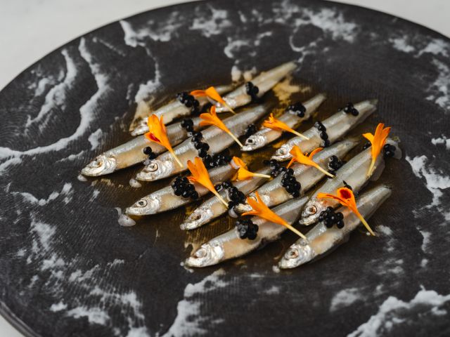 anchovies on a plate at Izy.Aki