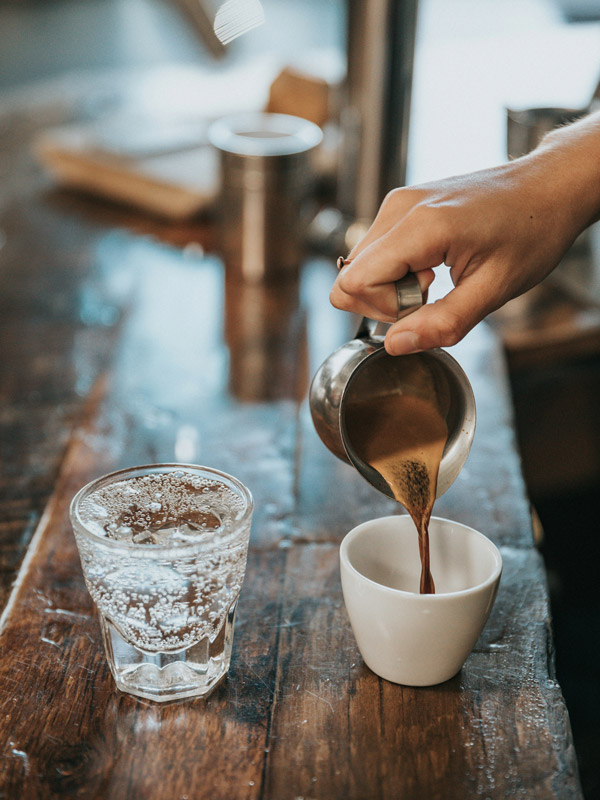 Pouring coffee in a cafe