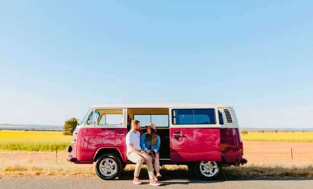 Couple parked by a canola field near Wagga Wagga