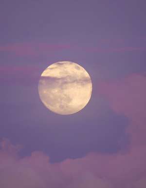 A full moon during sunset