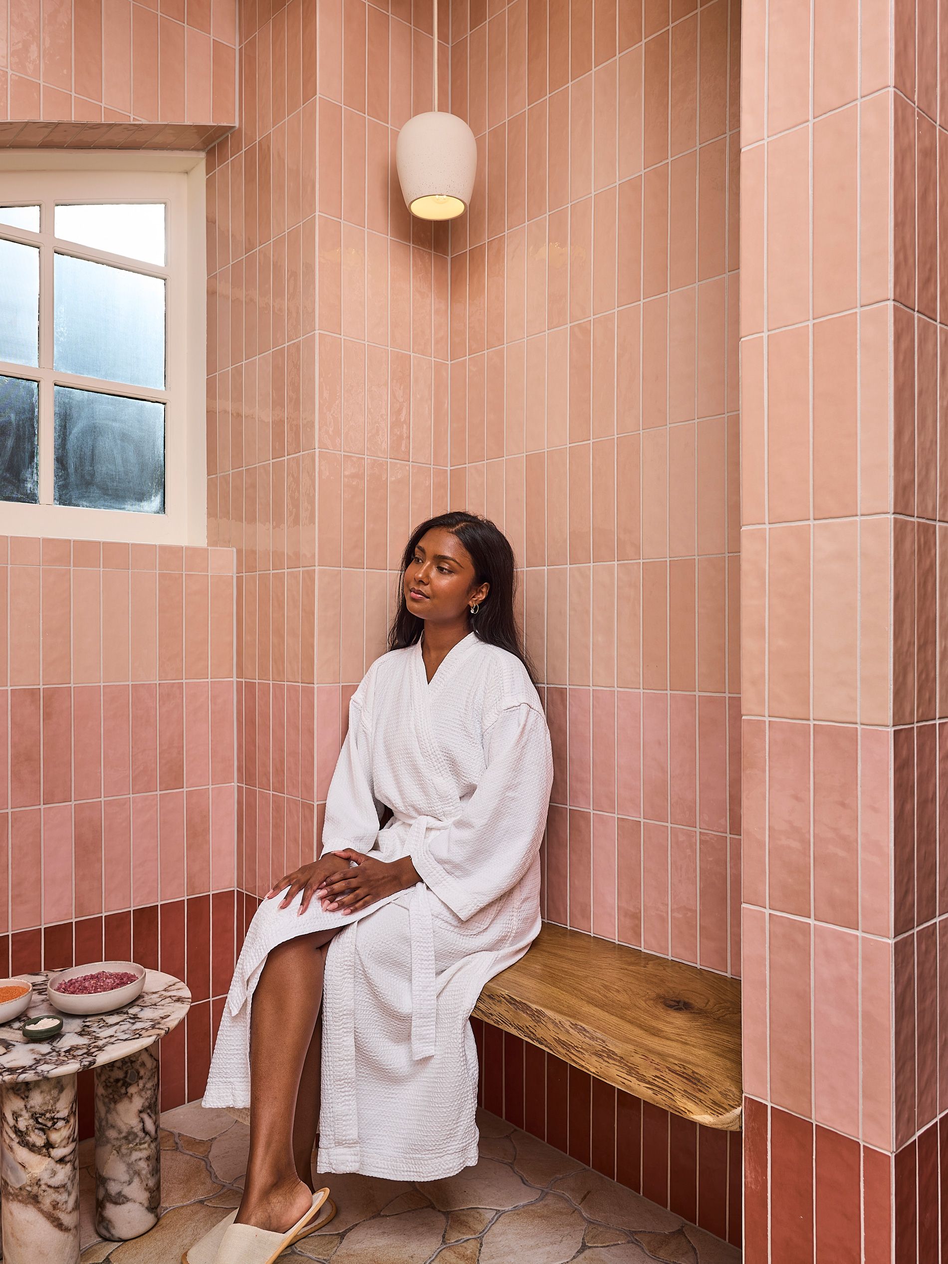 A woman waits for her private bathing experience at Hepburn Bathhouse & Spa