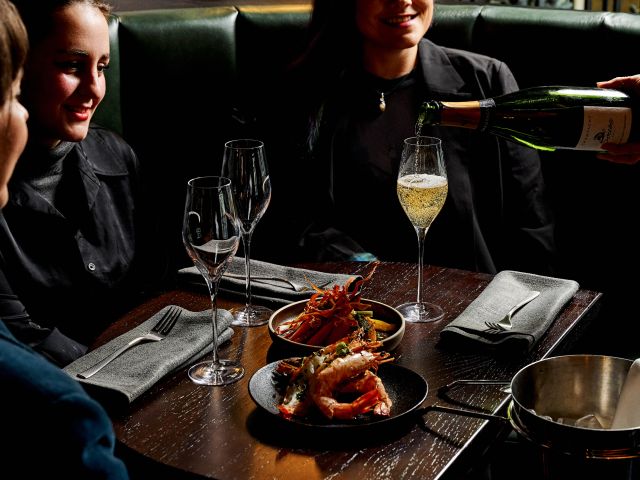 friends enjoying snacks and drinks at Black Kite Commune, Melbourne CBD