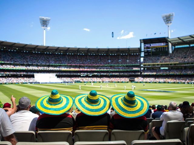 three punters in big hats at the melbourne cricket ground