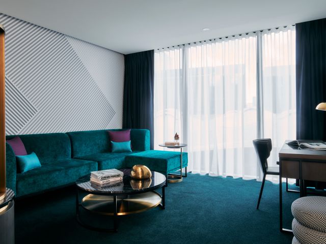 a look inside the suite living area at Mövenpick Hotel Melbourne On Spencer