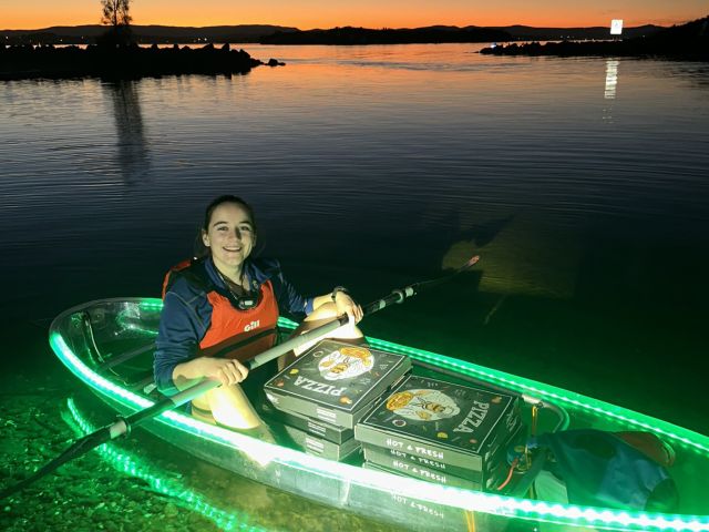 a host of Showtime Kayaking Tours bringing pizza for guests