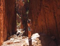woman walking through Standley Chasm near alice springs
