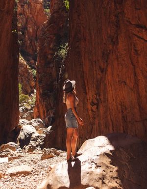 woman walking through Standley Chasm near alice springs