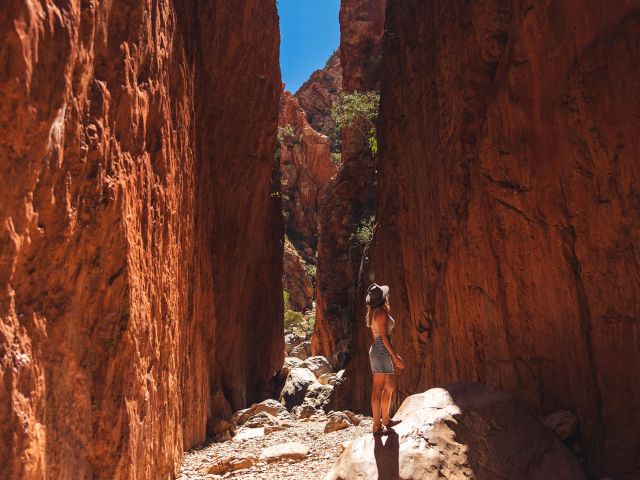 woman walking through Standley Chasm near alice springs