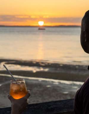 two people drinking cocktails at sunset bar, kingfisher bay resort