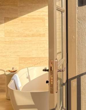 The Sanctuary Villa view of the bathroom and deck