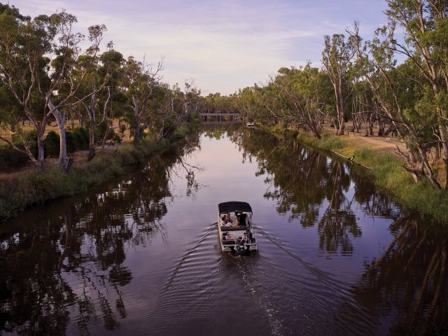 a boat travelling along the Wimmera River inDimboola