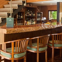 A timber wine cellar and bar with bar stools