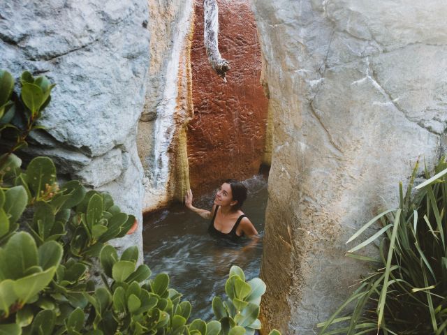 woman relaxing at Deep Blue Hot Springs