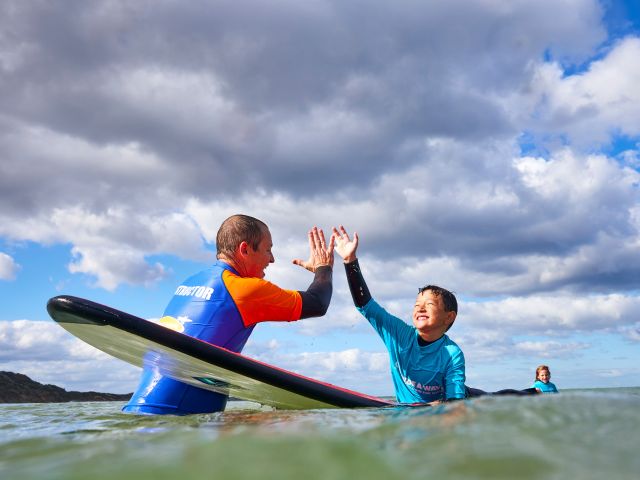 kid having a lesson with Go Ride A Wave