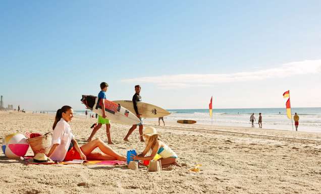 A family on the beach in the Gold Coast