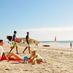 A family on the beach in the Gold Coast