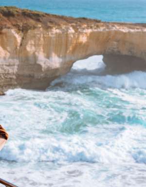 Woman looking at the 12 Apostles on the Great Ocean Road
