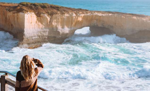 Woman looking at the 12 Apostles on the Great Ocean Road