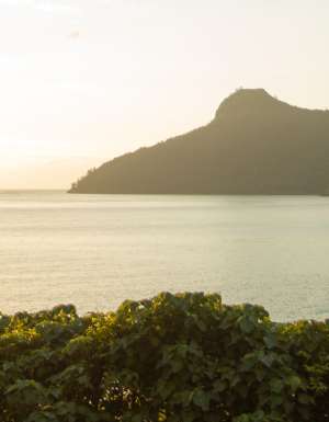 Sunset on Hamilton Island with views of the ocean and headland