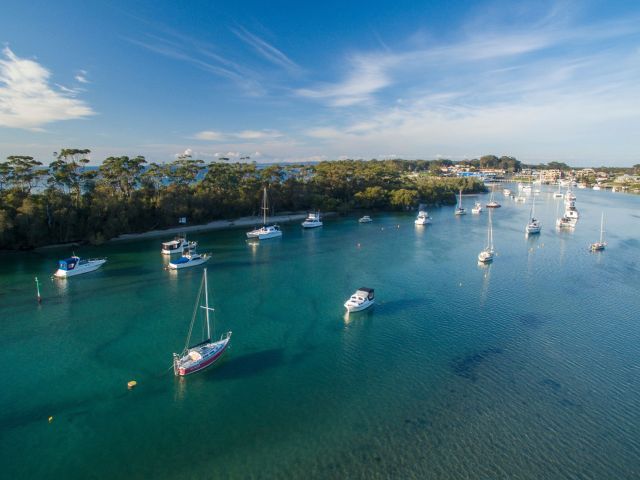 Boats moored in Currambene Creek, Huskisson in Jervis Bay on NSW South Coast