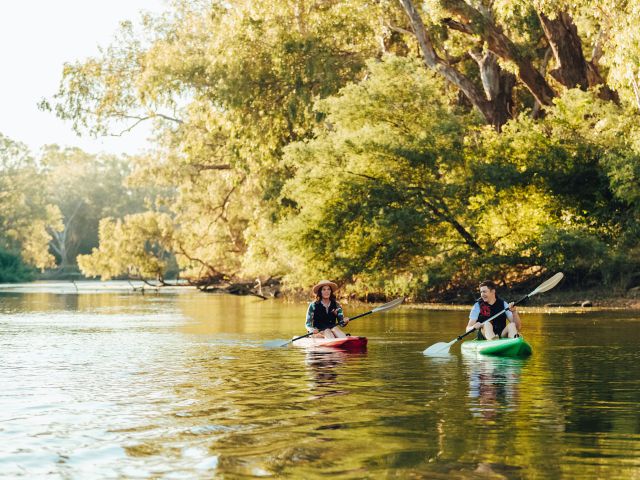 two people kayaking along the murray river at Noreuil Park
