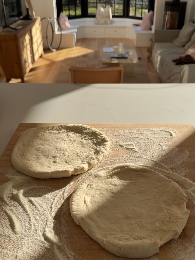 Stretching out the dough in the kitchen.