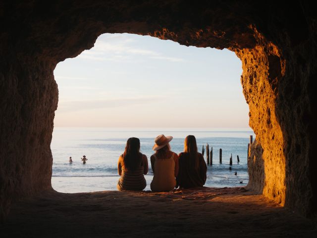three friends sitting on Port Willunga Beach Fleurieu Peninsula south australia