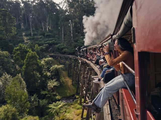 legs hanging over the sides of the train, Puffing Billy Railway