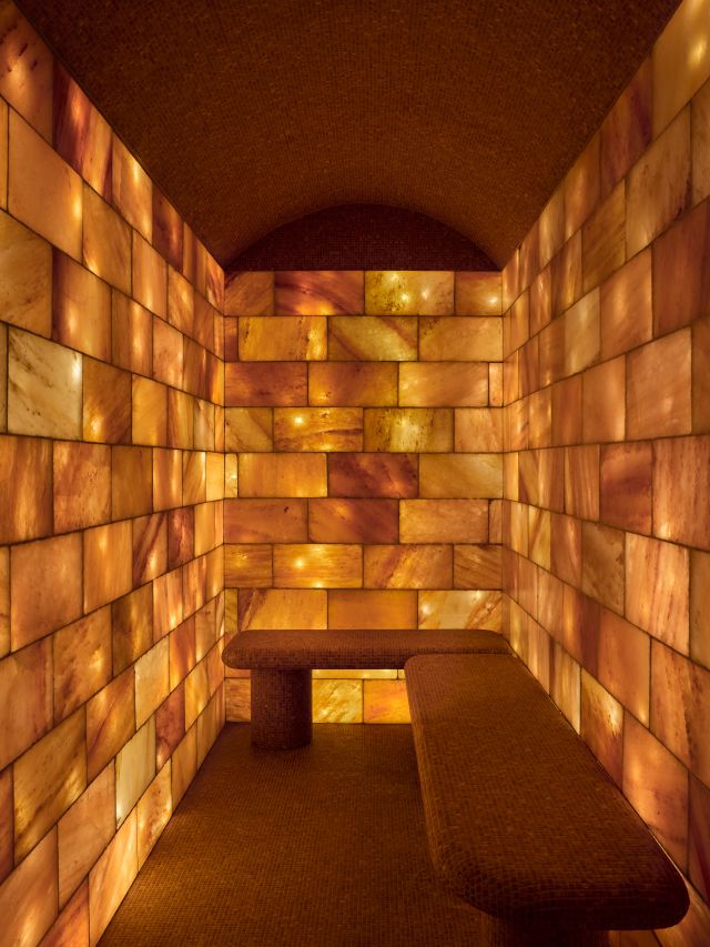 A travertine and Himalayan salt-lined Halotherapy Cave. 