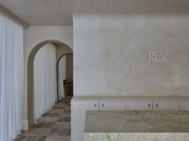 A minimalist reception area of a spa