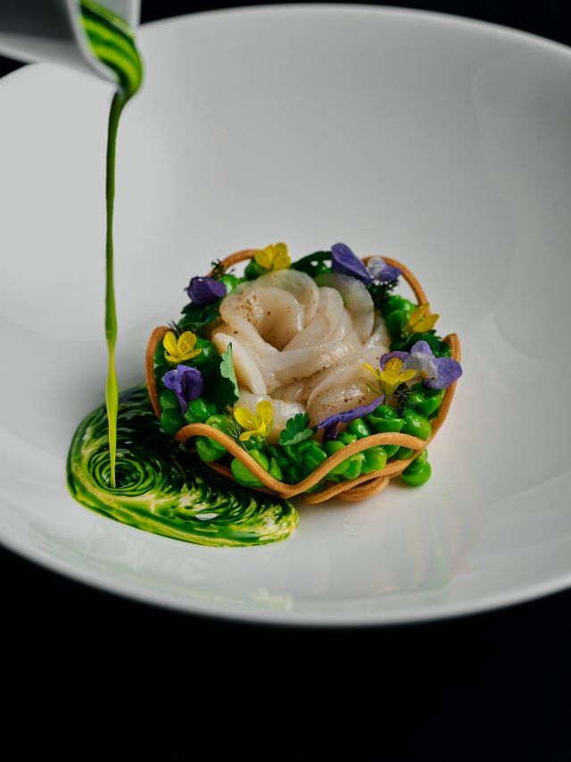 A chef prepares a dish at Society in Melbourne