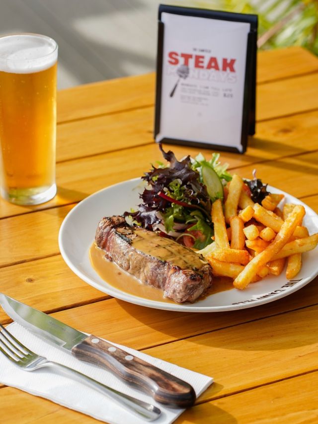 a generous brunch plate with beer at The Camfield, Perth