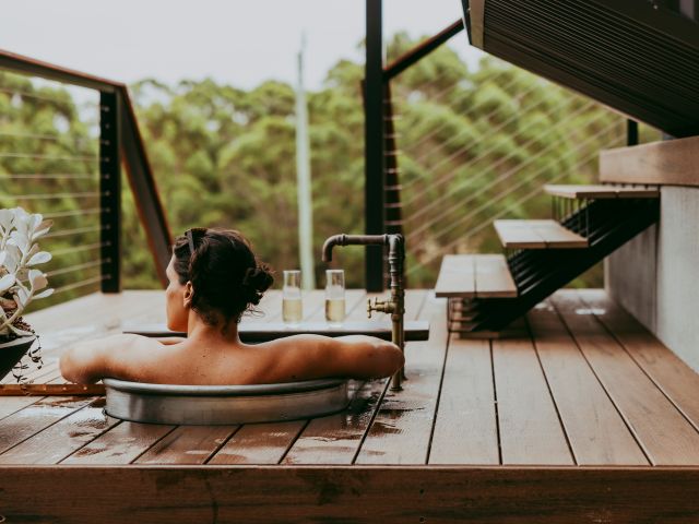 A person sitting in an outdoor bath