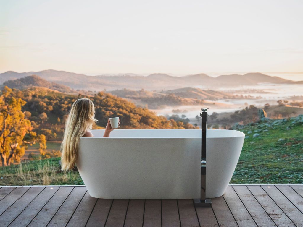 Woman in bathtub at Sierra escape in Mudgee