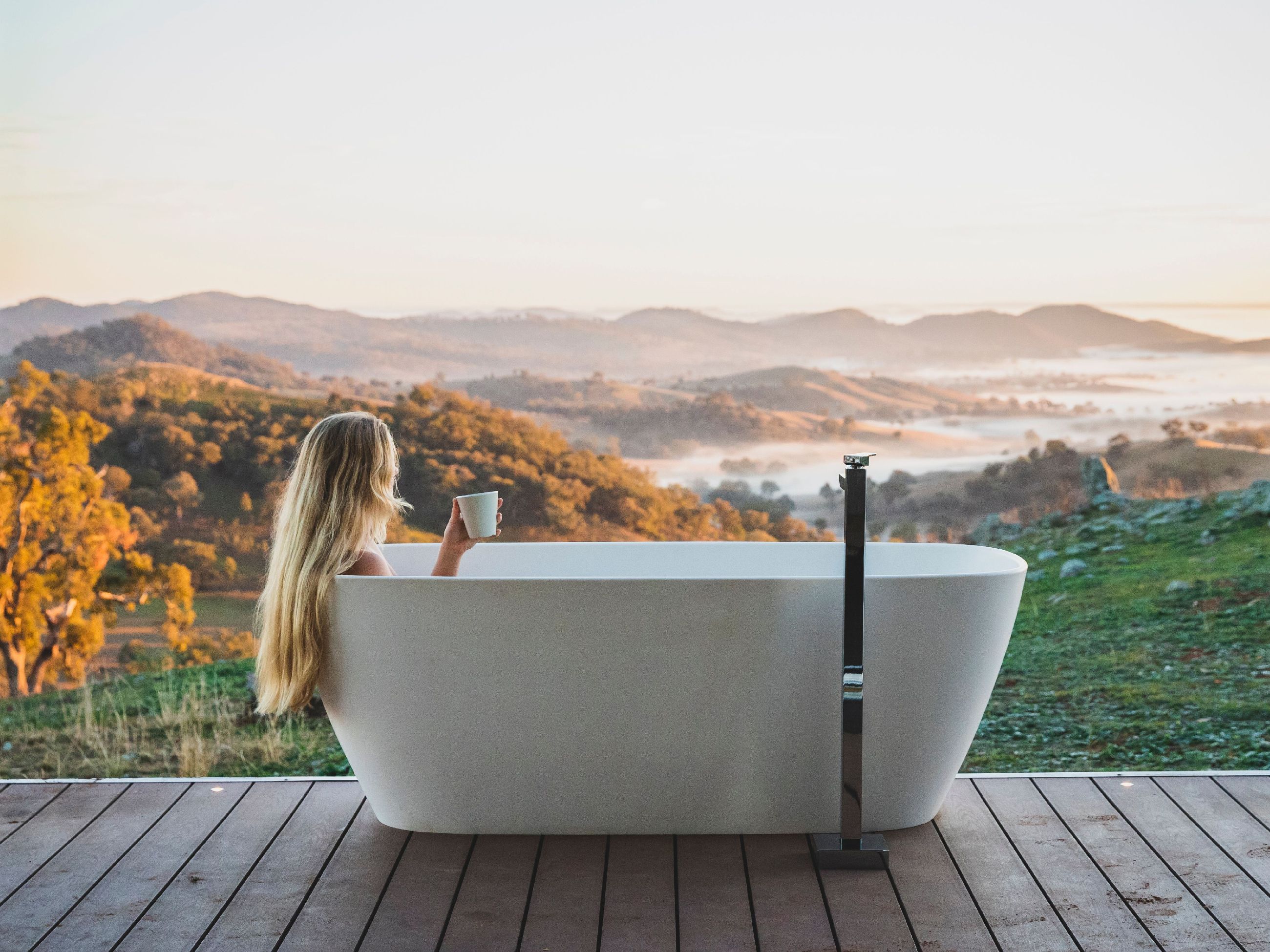 Woman in bathtub at Sierra escape in Mudgee
