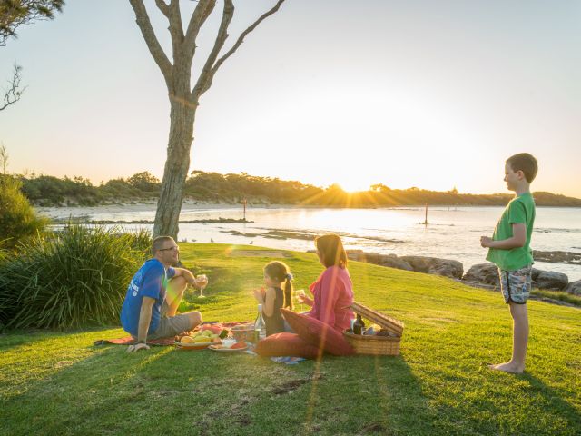 a family enjoying a picnic on Currarong Beach, Jervis Bay