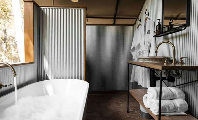 a private tub with bush views at Paperbark Camp, Woollamia