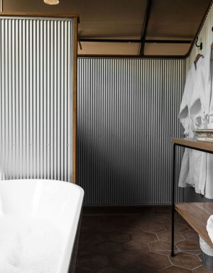 a private tub with bush views at Paperbark Camp, Woollamia