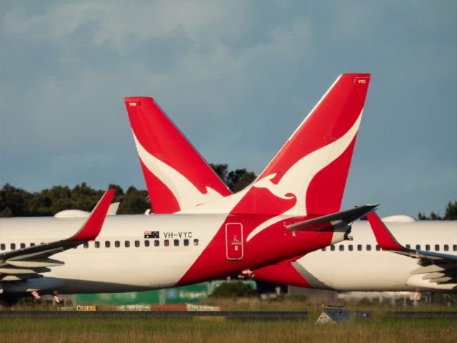 Two Qantas planes on at the airport