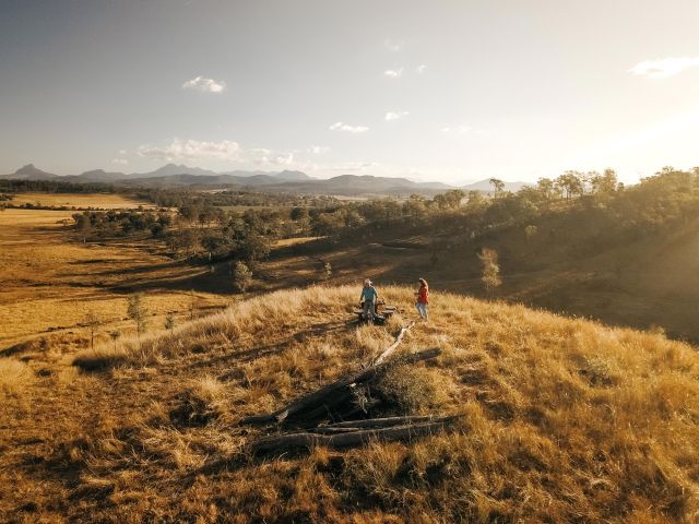 Couple Hiking nearby their Larapinta campsite in Queensland's Scenic Rim