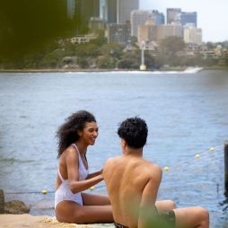 Couple enjoying a swim at Marrinawi Cove in Barangaroo, Sydney swimming spots reopening for summer