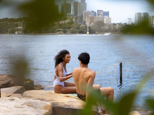 Couple enjoying a swim at Marrinawi Cove in Barangaroo in sydney