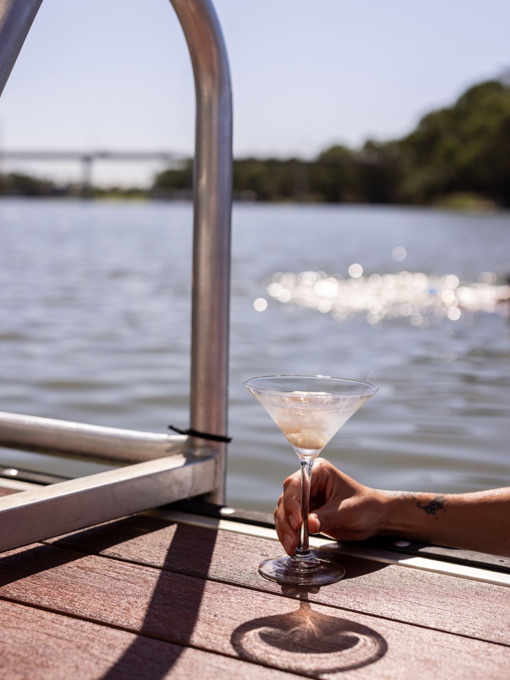cocktail by the water on a Murray River houseboat