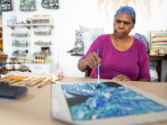 artist at Aboriginal Bush Traders in darwin