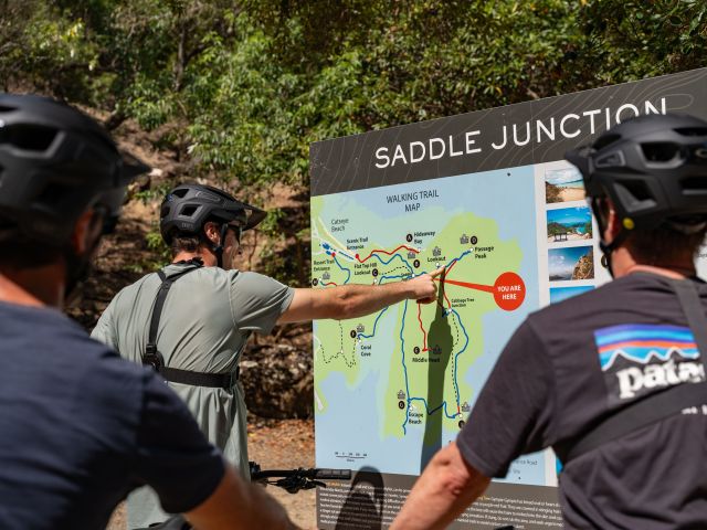 mountain bikers at the Saddle Junction Walking Trail Map