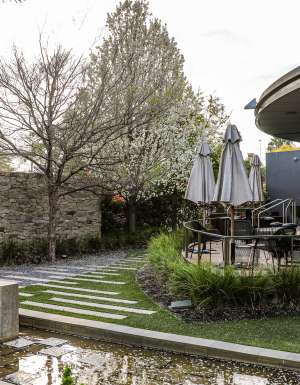 an outdoor seating area surrounded by lush greenery at Junction Moama