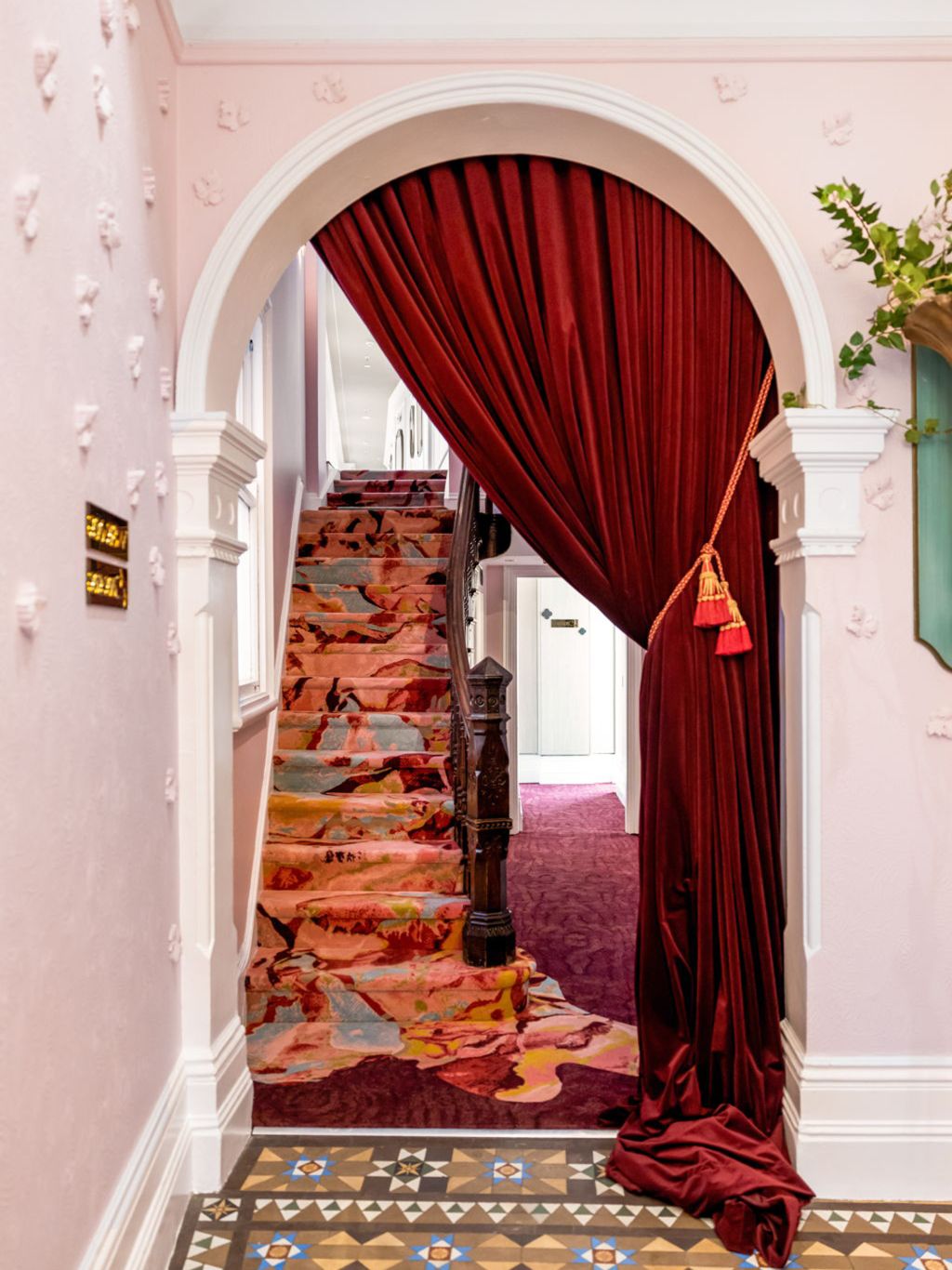 a vibrant stairs leading to the rooms at Medusa Hotel