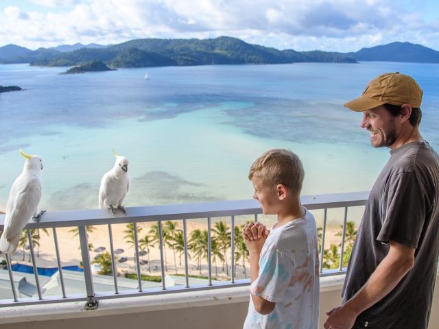 family at reef view hotel balcony