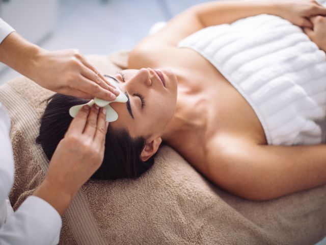 Woman receiving a head massage